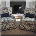 F05. Pair of custom upholstered swivel club chairs. 35"h x 36"w x 40"d 